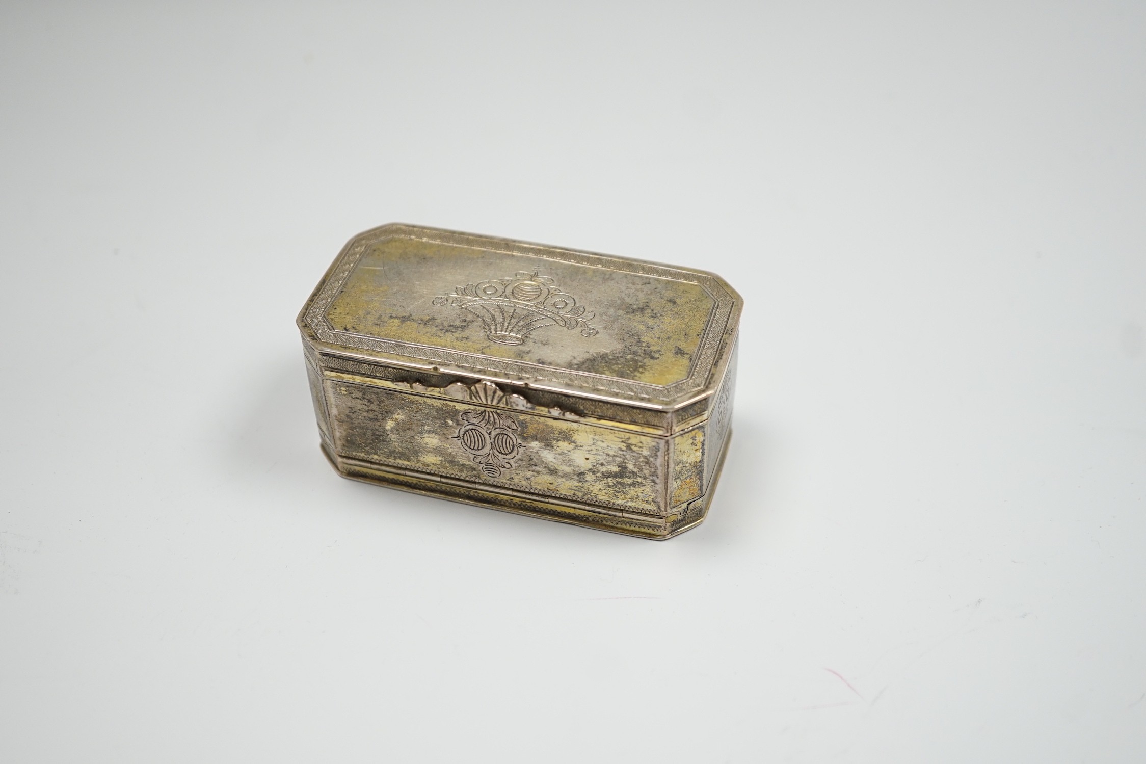 A 19th century German? engraved gilt white metal double hinged octagonal snuff box, 86mm.